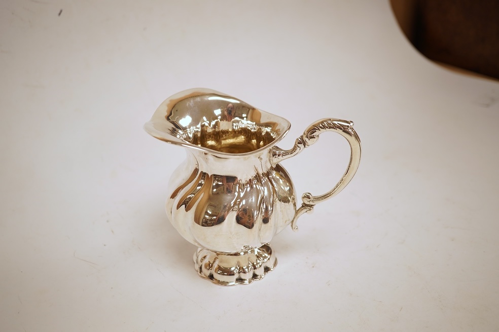 A 20th century Hungarian 800 standard white metal pedestal milk jug, post 1937 mark, height 10.6cm, 7.4oz.